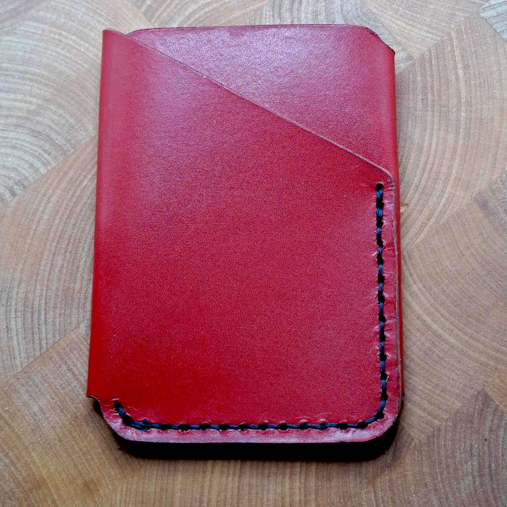 Card holder in red with black stitching